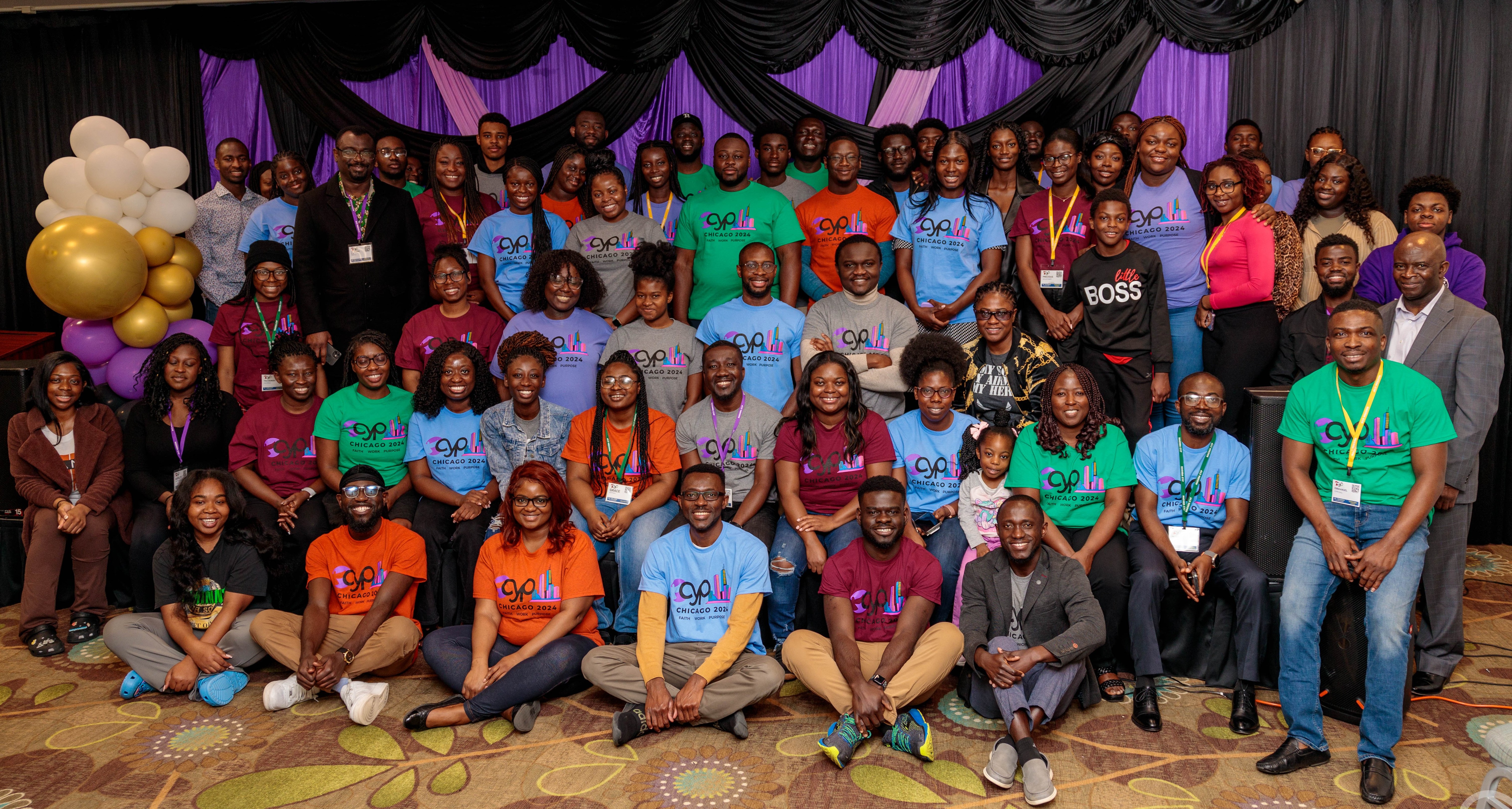 CYP community gathering with members wearing colorful event shirts